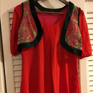 Dress with embroidered jacket.